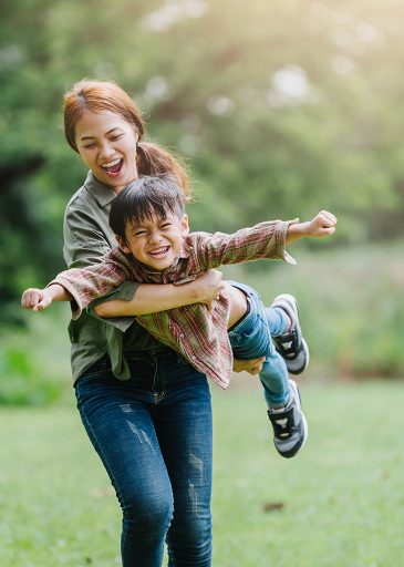 happy harmonious family outdoors concept.mother and son have activities together on holidays.